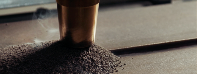 Close-up of an SAW torch during submerged arc welding